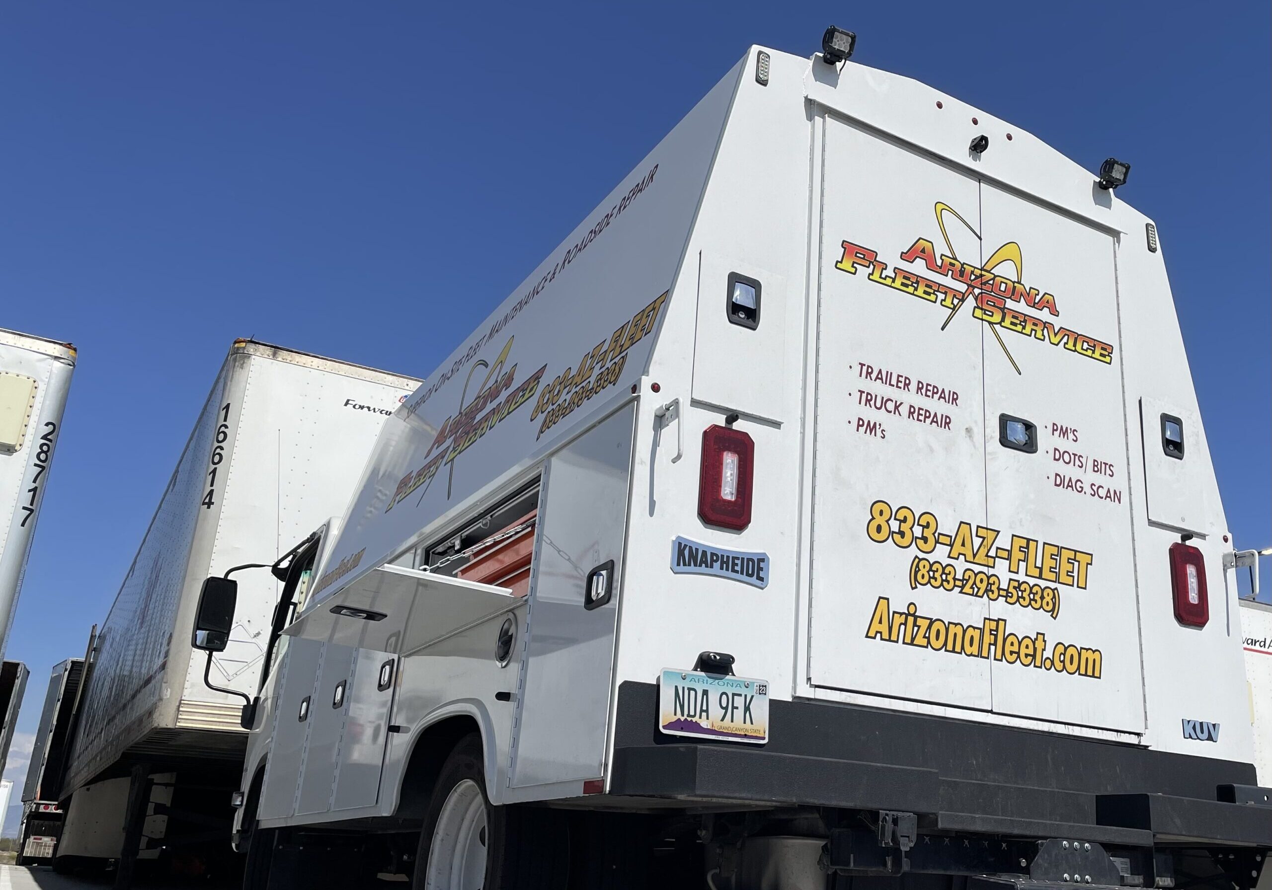 Professional mechanic performing emergency mobile truck repair in Phoenix, AZ